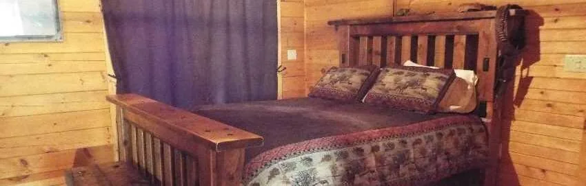 Log home bedroom with natural wood interior details
