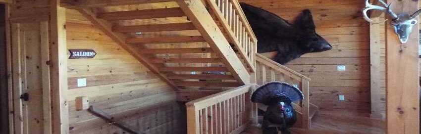 log home stairways with stuffed turkey and a bearskin rug on the wall, crooked creek construction, home page slider, image 2
