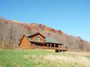 Crooked Creek Construction Log Home Exterior Log Home Against Fall Foliage